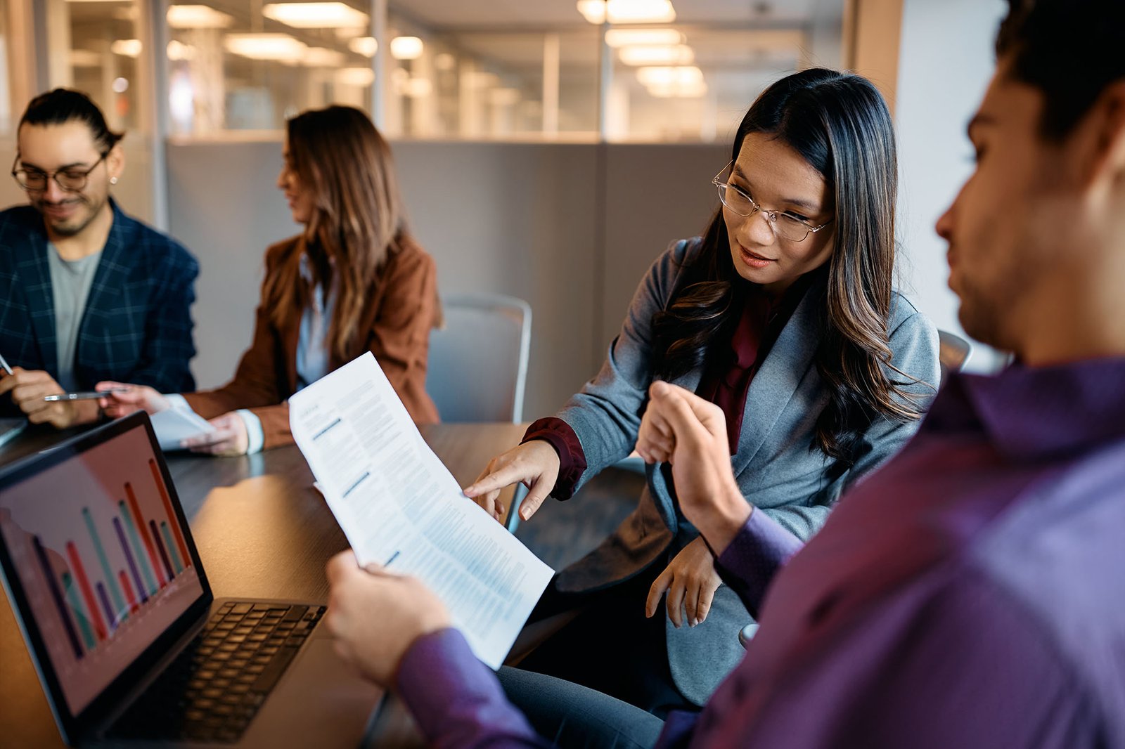 team discussing data in modern office